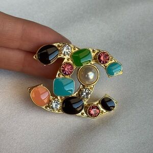 Elegant Designer Brooch with Jewel Tones